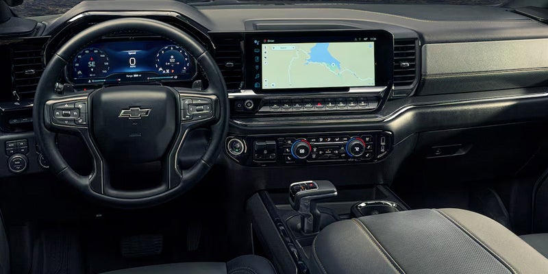 Interior design of a Chevrolet Silverado 1500 showcasing the center console and steering wheel