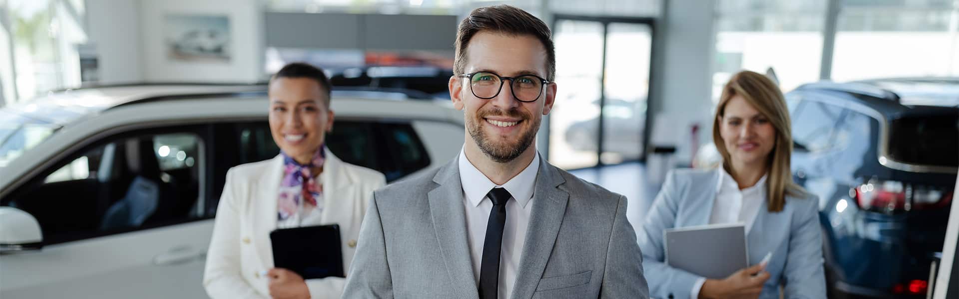 Friendly salesperson smiling in a warm welcome