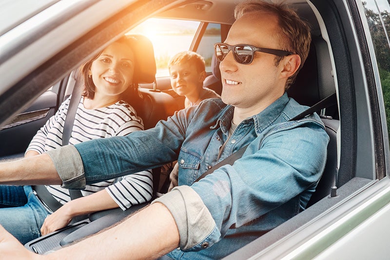 Happy family inside a car