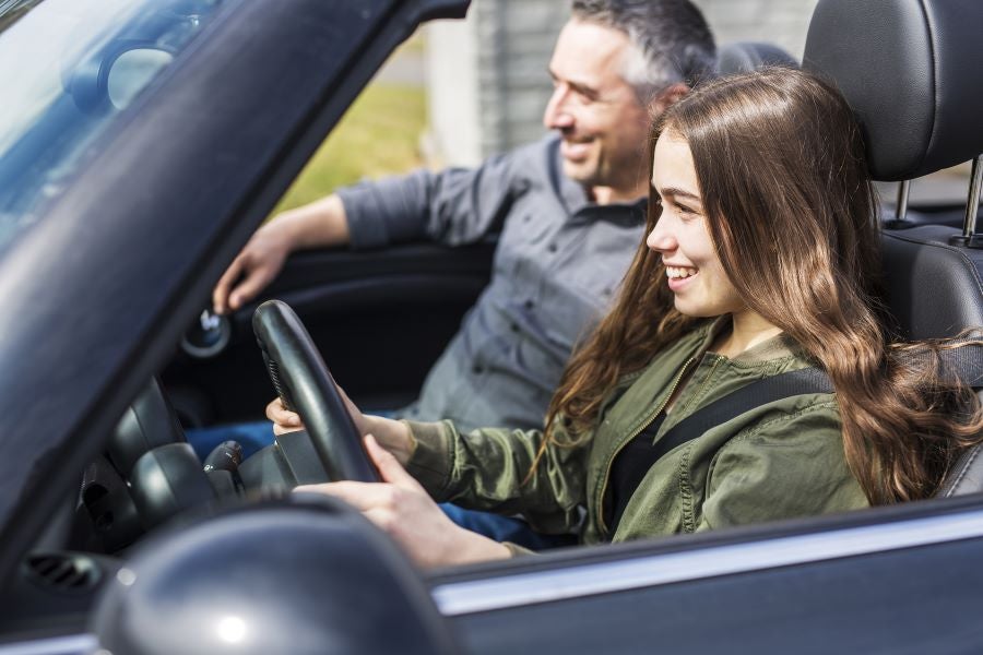 Woman driving with man in passenger seat